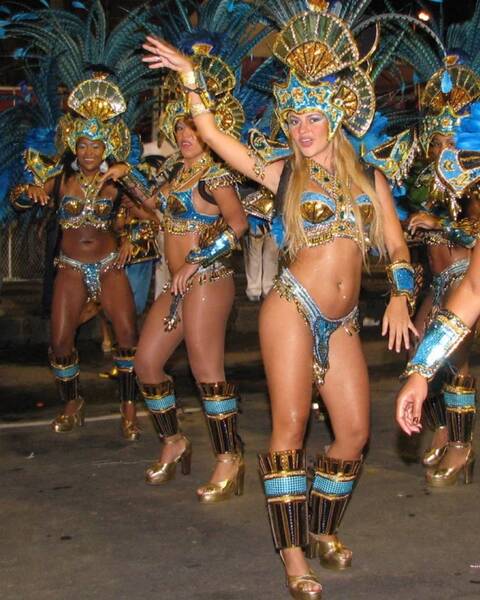 Brazilian women dancing in costumes showing 